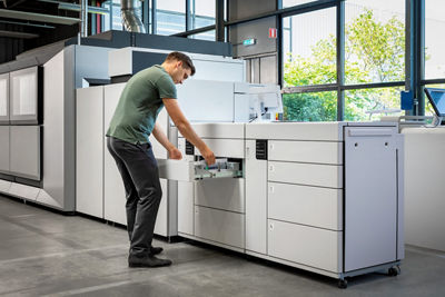 man working with Color Sheetfed Press